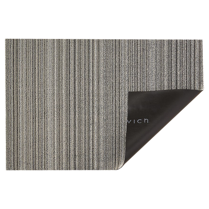 Wonderfully striped, the textured "looped" look of this Shag Mat is tufted from durable extruded yarns.