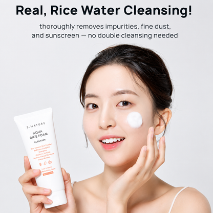 model holding s.nature aqua rice foam cleanser with cleanser applied to her cheek, highlighting rice water cleansing for removing impurities, fine dust, and sunscreen.