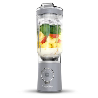 Portable blender with fruits inside on a white background, featuring the GreenPan brand.