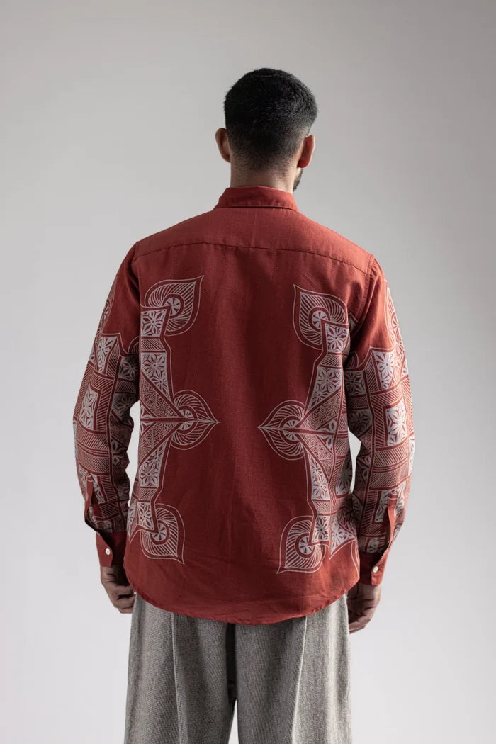 Man wearing the Terra Rangoli shirt with grey trousers, waist-up back view showing the rangoli motifs