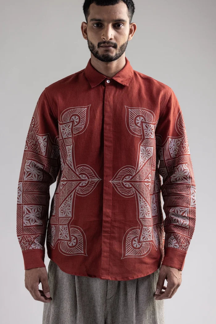 Man wearing the Terra Rangoli shirt, waist-up front view with the rangoli motifs on the chest and sleeves