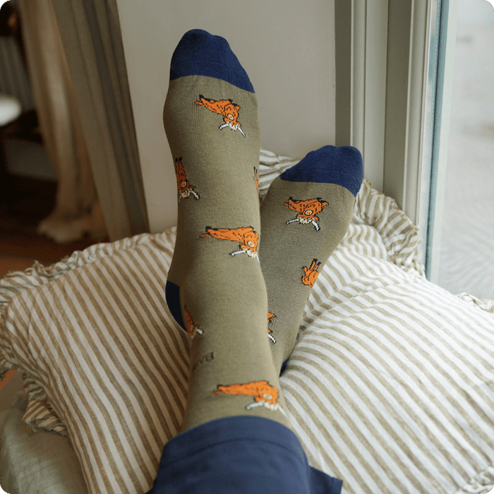 model wearing green highland cow bamboo socks