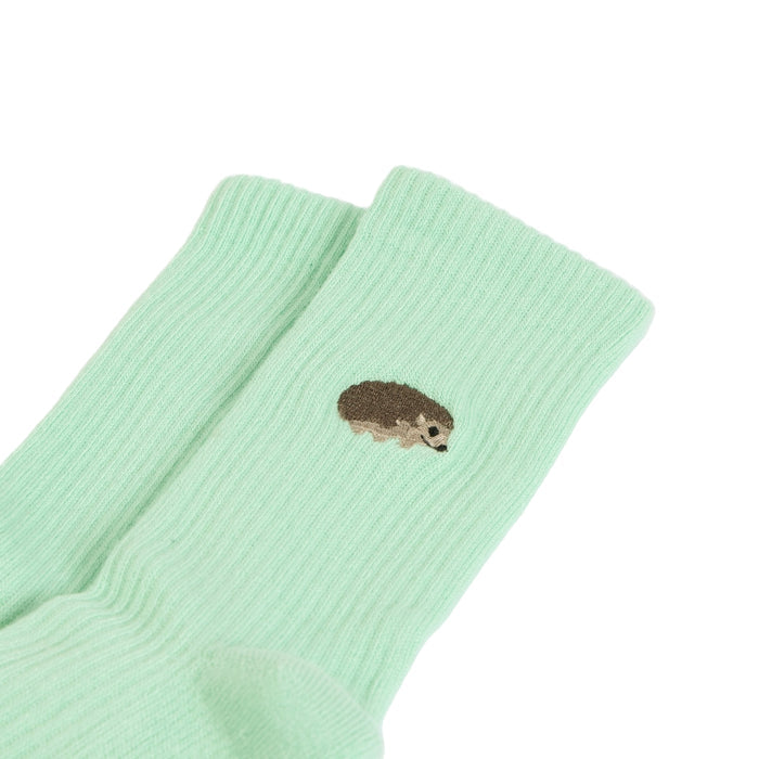 flat lays of green hedgehogs ribbed bamboo socks