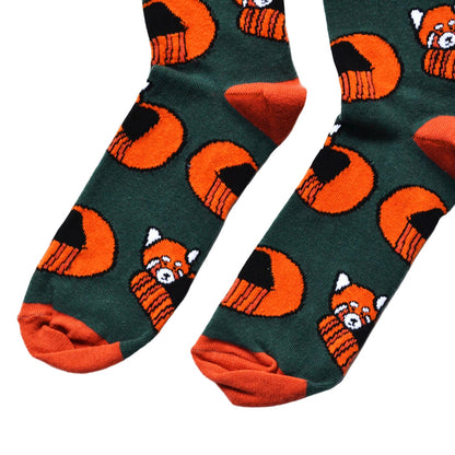toe closeup flat lay of dark green bamboo socks with woven red panda design
