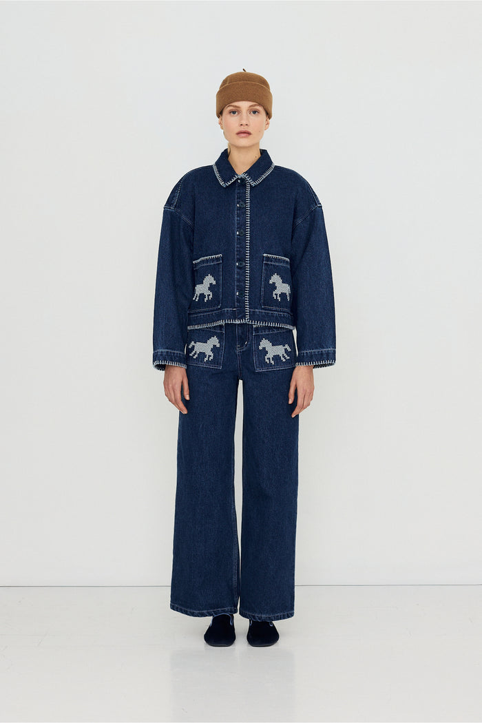 Tiny Big Sister Embroidered Horses Denim Trousers AW26-789 modeled in denim Shop Tiny Big Sister at Dotique