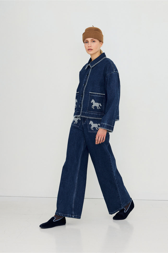 Tiny Big Sister Embroidered Horses Denim Trousers AW26-789 worn by model Shop Tiny Big Sister at Dotique